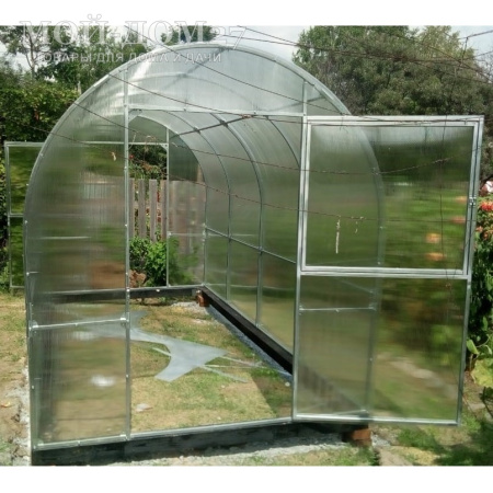 Теплица Трубная Двушка 2х10 метров с поликарбонатом | Мой-Дом27 | Каркас изготовлен из оцинкованной замкнутой трубы 20*20 мм.<br>
 <b>Ширина - 2 метра</b>. Высота - 2,15 метра. Длина 10 метров.<br>
 Выдерживаемая снеговая нагрузка - 100 кг/м2. Выдерживаемая ветровая нагрузка - до 22 м/с.<br>
 Расстояние между дугами 1 метр. <b>Толщина металла дуг 1,2 мм</b>. Ширина двери 0,96 метра.<br>