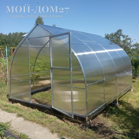 Теплица Дачница Остроконечная 12 метров с поликарбонатом | Мой-Дом27 | Каркас изготовлен из оцинкованной замкнутой трубы 30*20 мм.<br>
 Ширина - 3 метра. Высота - 2,2 метра. Длина 12 метров.&nbsp;<br>
 Выдерживаемая снеговая нагрузка - 80 кг/м2. Выдерживаемая ветровая нагрузка - до 15 м/с.&nbsp;<br>
 Расстояние между дугами 1 метр. Толщина металла 1&nbsp;мм.&nbsp;<b>Форма - капелька</b><br>